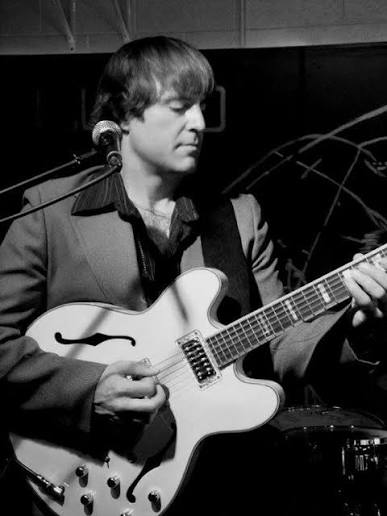 Bub Pratt performing on guitar